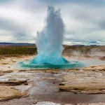 The Great Geysir erupting in spring, Iceland