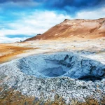Magical dramatic scene with geothermal swamp and volcanoes  in Hverir (Hverarond) valley  in the Myvatn region. Iceland. Exotic countries. Amazing places.