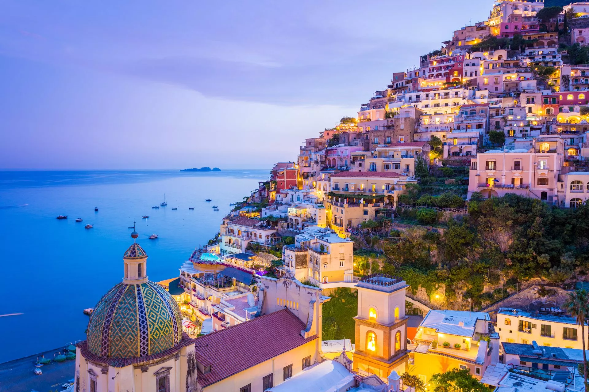 View of the postiano town and the seaside in a summer sunset