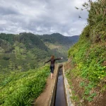 Woman hiker at Levada Nova mountain hiking path, Madeira.